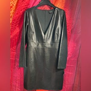 BRAND NEW Bebe black long sleeve dress. Fully lined. Looks like leather snake 14